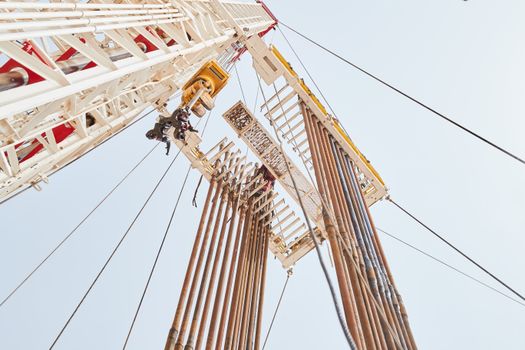 Services Dynamic low angle view of an oil rig structure in Al Wafrah, Kuwait.